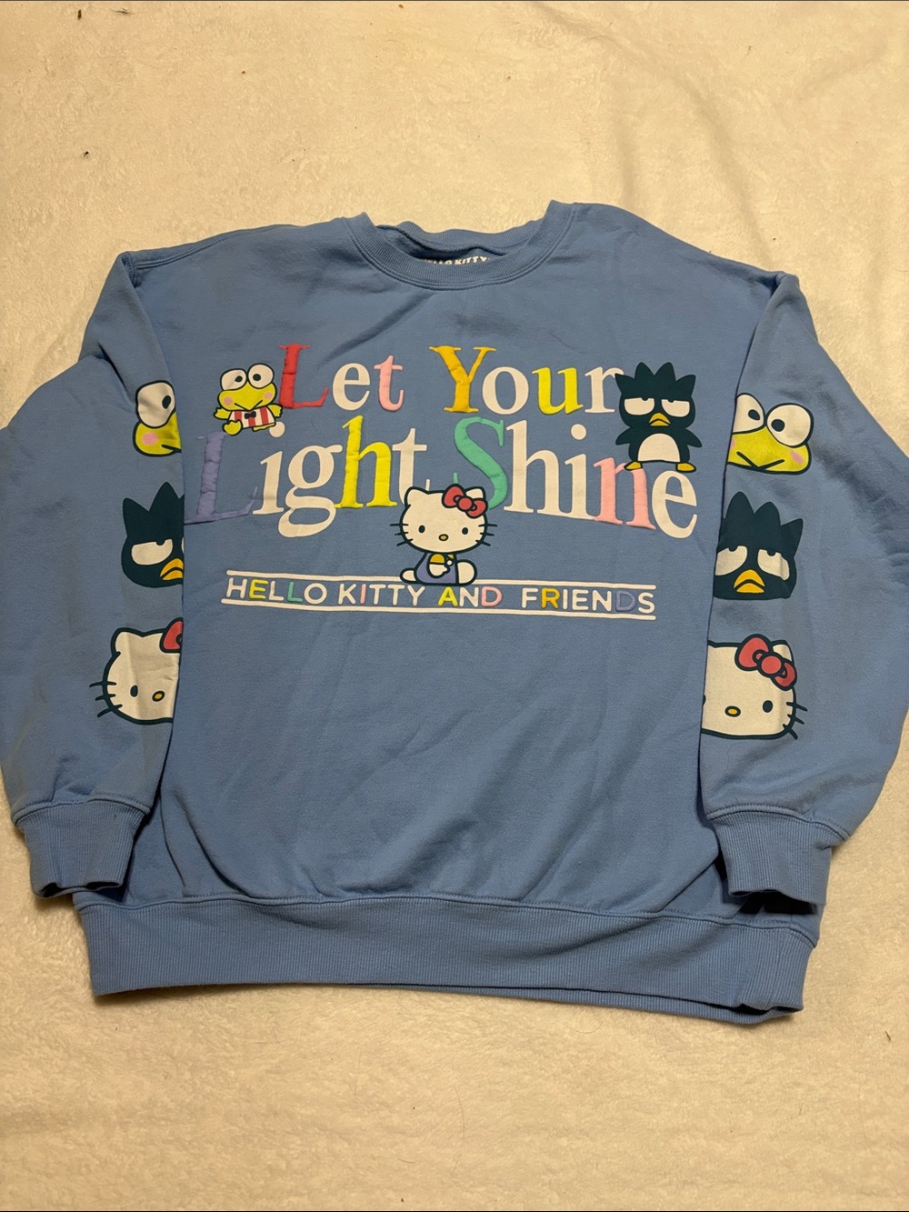 Hello Kitty Blue Crewneck Sweatshirt with Colorful 'Let Your Light Shine' Print